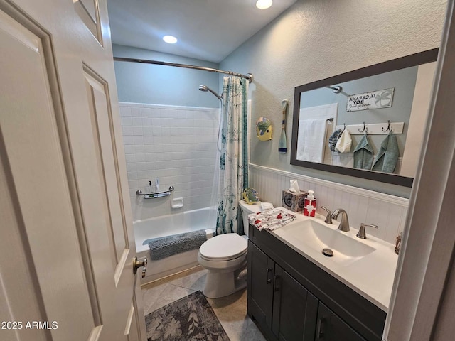 full bathroom featuring vanity, tile patterned flooring, shower / bathtub combination with curtain, and toilet