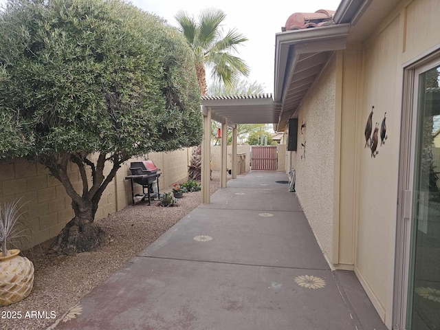 view of patio featuring a grill