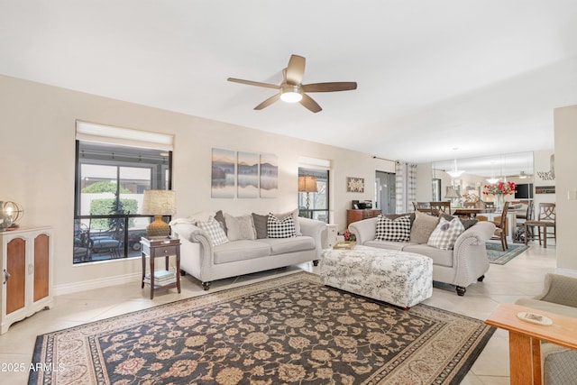 tiled living room featuring ceiling fan