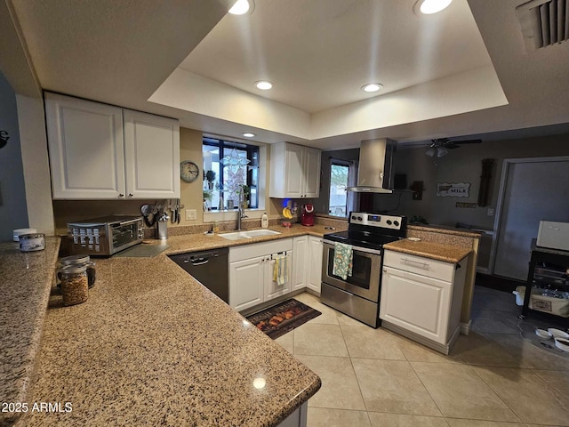 kitchen with black dishwasher, white cabinetry, wall chimney exhaust hood, and stainless steel range with electric cooktop