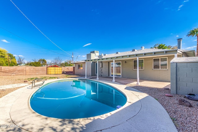 view of pool with a patio, a fenced in pool, and a fenced backyard