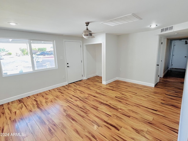 unfurnished room featuring light hardwood / wood-style flooring and ceiling fan