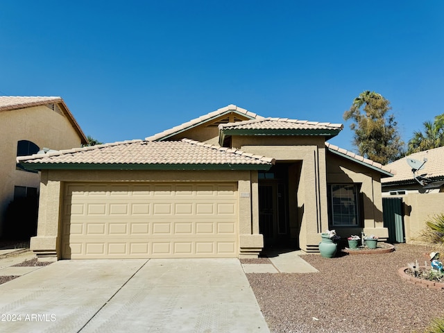 5984 W Geronimo Ct, Chandler, AZ 85226 - view of front facade with a tile roof, stucco siding, an attached garage, and concrete driveway