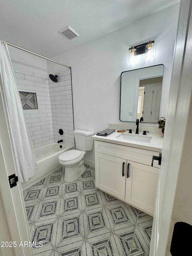 5984 W Geronimo Ct, Chandler, AZ 85226 - bathroom with visible vents, toilet, vanity, a textured wall, and shower / bath combo with shower curtain