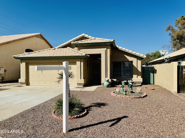 5984 W Geronimo Ct, Chandler, AZ 85226 - view of front facade with a tiled roof, driveway, stucco siding, and an attached garage