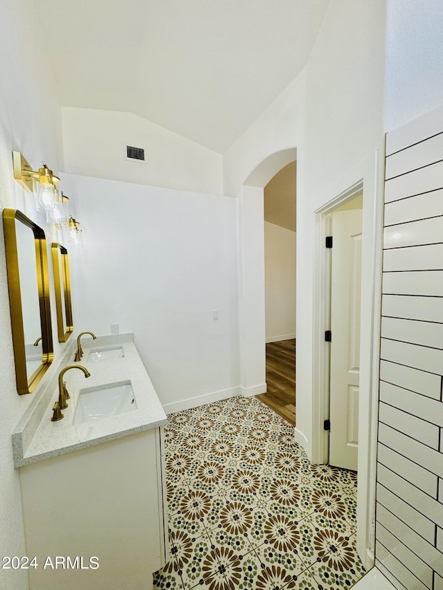 5984 W Geronimo Ct, Chandler, AZ 85226 - bathroom featuring double vanity, a sink, vaulted ceiling, and visible vents