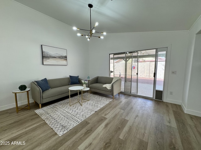 5984 W Geronimo Ct, Chandler, AZ 85226 - living room featuring baseboards, lofted ceiling, wood finished floors, and a chandelier