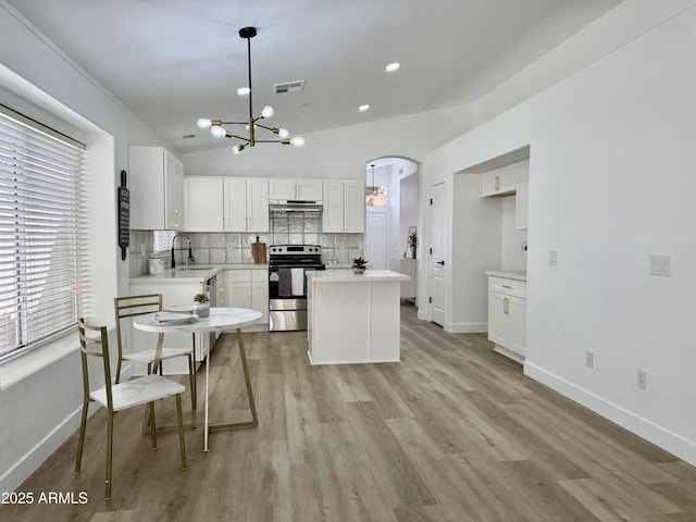 5984 W Geronimo Ct, Chandler, AZ 85226 - kitchen with tasteful backsplash, an inviting chandelier, stainless steel range with electric stovetop, a sink, and visible vents