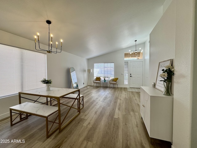 5984 W Geronimo Ct, Chandler, AZ 85226 - dining area with baseboards, high vaulted ceiling, a chandelier, and light wood-style floors