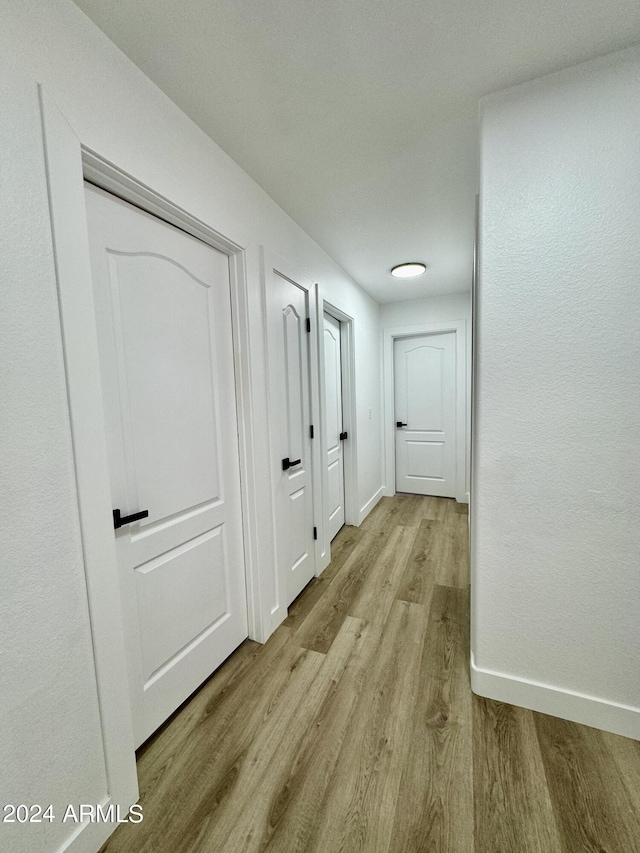 5984 W Geronimo Ct, Chandler, AZ 85226 - corridor with baseboards and wood finished floors