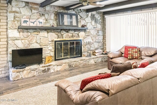 2452 Daisy Trl, Forest Lakes, AZ 85931 - living area featuring wood finished floors, beam ceiling, a fireplace, and a ceiling fan