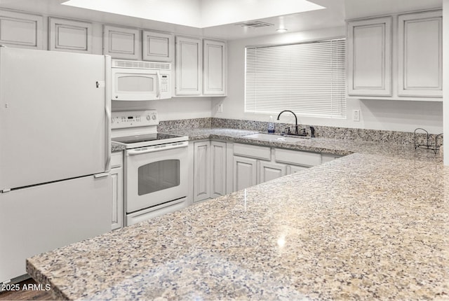 2452 Daisy Trl, Forest Lakes, AZ 85931 - kitchen featuring white appliances, a sink, and light stone countertops