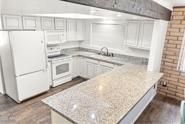 2452 Daisy Trl, Forest Lakes, AZ 85931 - kitchen featuring white appliances, a sink, a peninsula, dark wood-type flooring, and light stone counters