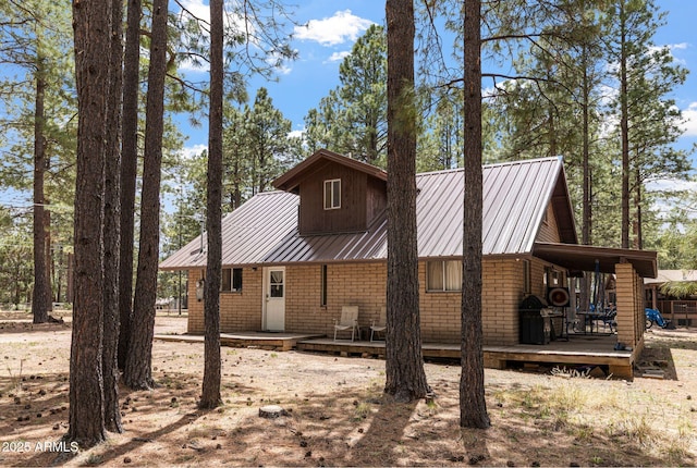 2452 Daisy Trl, Forest Lakes, AZ 85931 - rear view of property with a wooden deck and metal roof