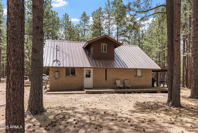 2452 Daisy Trl, Forest Lakes, AZ 85931 - back of house featuring metal roof and a deck