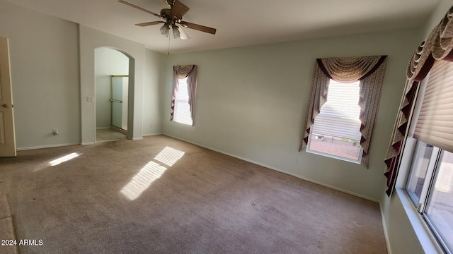 unfurnished bedroom featuring ceiling fan and light carpet