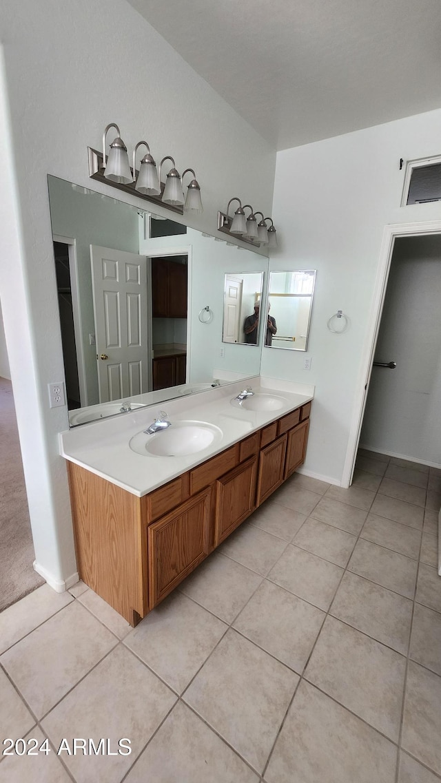 bathroom featuring tile patterned flooring and vanity