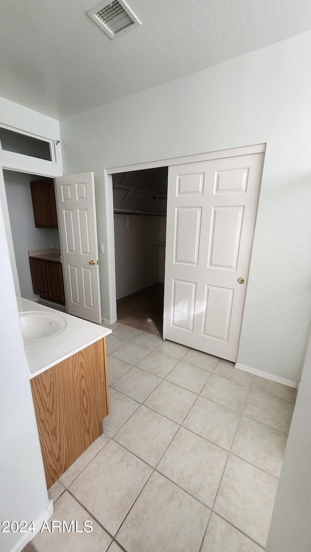 bathroom featuring tile patterned floors and vanity