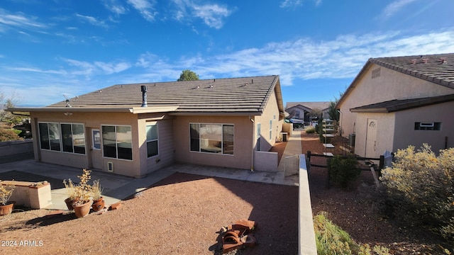 rear view of house featuring a patio