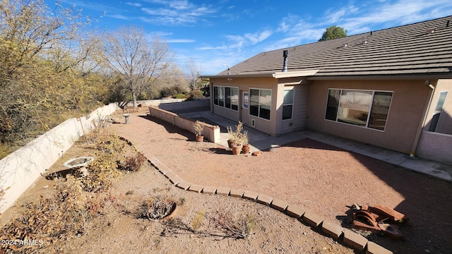 back of house featuring a patio