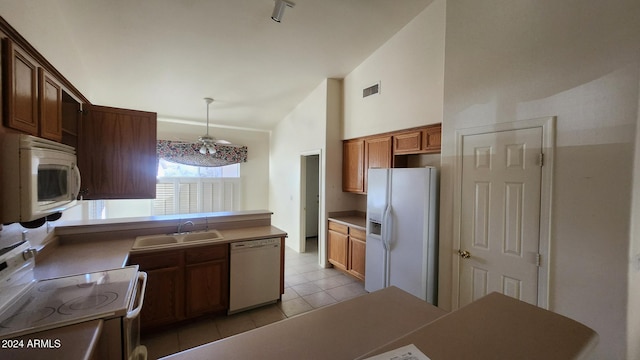 kitchen with ceiling fan, sink, hanging light fixtures, white appliances, and light tile patterned floors