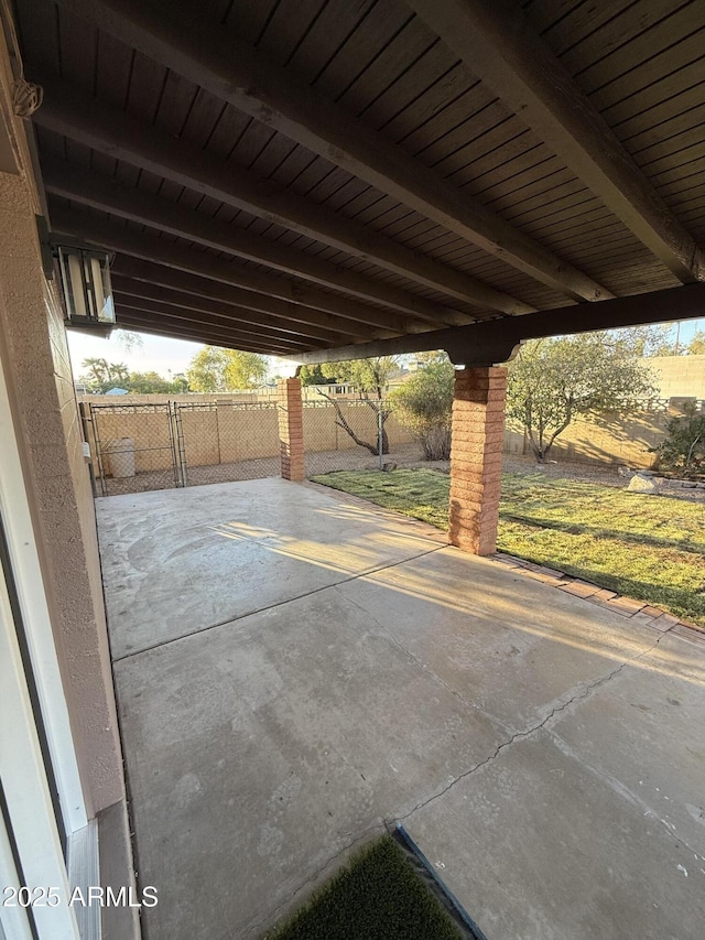 view of patio featuring fence