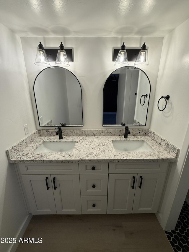 full bath with double vanity and a sink