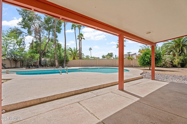 view of pool with a patio, a fenced in pool, and a fenced backyard