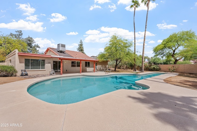 view of pool with a diving board, central AC unit, a patio area, fence, and a fenced in pool