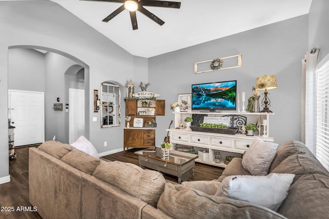 32881 N Hidden Canyon Dr, San Tan Valley, AZ 85144 - living area with dark wood-style floors, arched walkways, baseboards, high vaulted ceiling, and ceiling fan