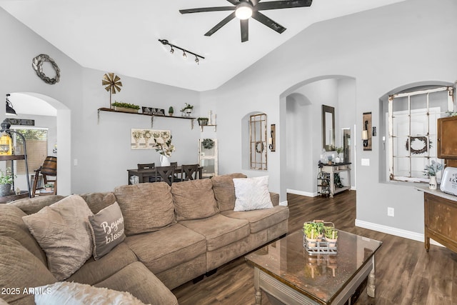 32881 N Hidden Canyon Dr, San Tan Valley, AZ 85144 - living area with lofted ceiling, arched walkways, ceiling fan, and dark wood-style flooring