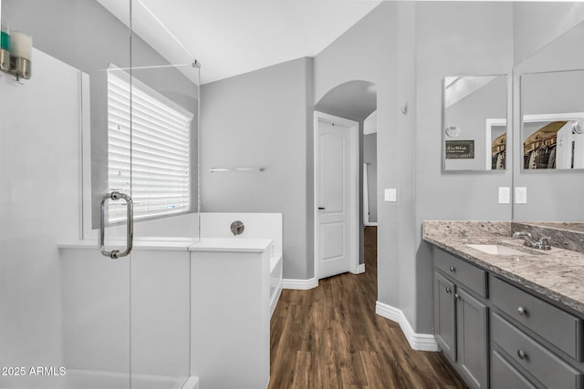 32881 N Hidden Canyon Dr, San Tan Valley, AZ 85144 - full bathroom featuring a bath, baseboards, vanity, and wood finished floors