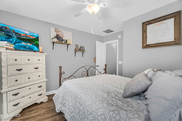 32881 N Hidden Canyon Dr, San Tan Valley, AZ 85144 - bedroom with dark wood finished floors, baseboards, a ceiling fan, and visible vents