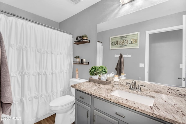 32881 N Hidden Canyon Dr, San Tan Valley, AZ 85144 - full bathroom featuring a shower with shower curtain, wood finished floors, toilet, and vanity