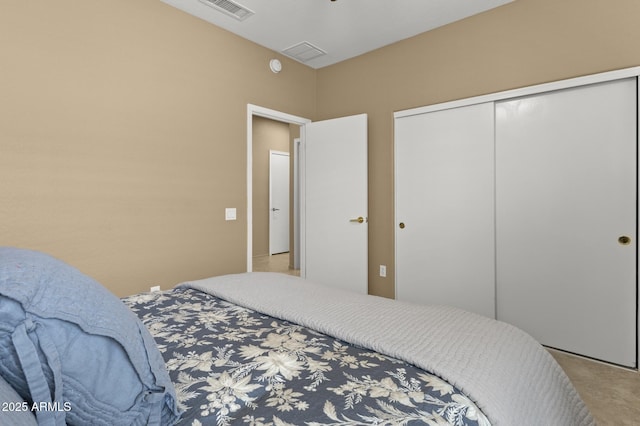 bedroom with visible vents and a closet