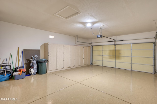 garage featuring a garage door opener