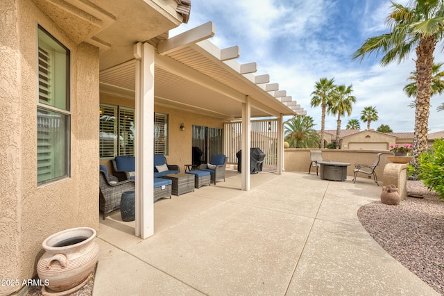 view of patio / terrace featuring an outdoor living space with a fire pit