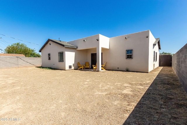 3614 W Granada Rd, Phoenix, AZ 85009 - back of property with stucco siding and a fenced backyard