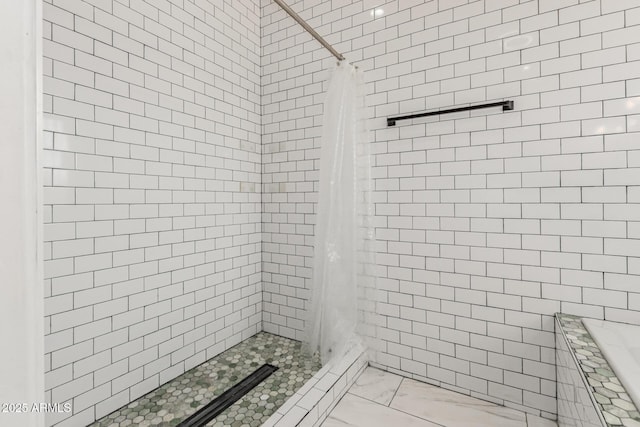 3614 W Granada Rd, Phoenix, AZ 85009 - full bath featuring marble look tiles, a shower stall, and tile walls