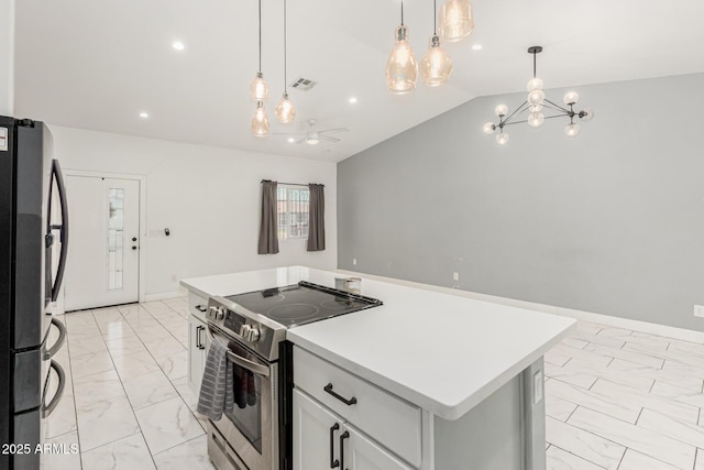 3614 W Granada Rd, Phoenix, AZ 85009 - kitchen featuring appliances with stainless steel finishes, light marble finish floors, lofted ceiling, a kitchen island, and light countertops
