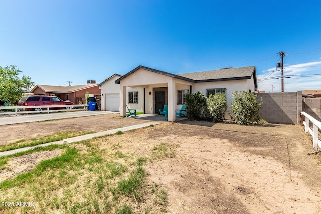 3614 W Granada Rd, Phoenix, AZ 85009 - single story home with an attached garage, stucco siding, and driveway