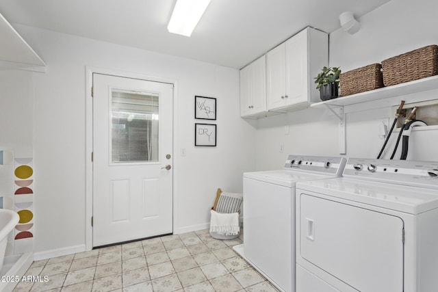 washroom with independent washer and dryer, cabinets, and light tile patterned floors