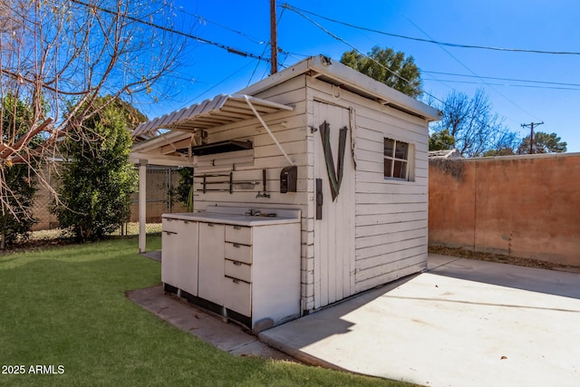 view of outdoor structure with a lawn