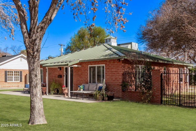 back of property featuring a yard, an outdoor hangout area, and a patio