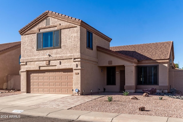 view of front of property with a garage