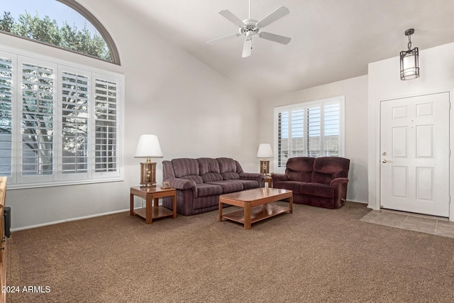 living room featuring ceiling fan, carpet floors, and high vaulted ceiling