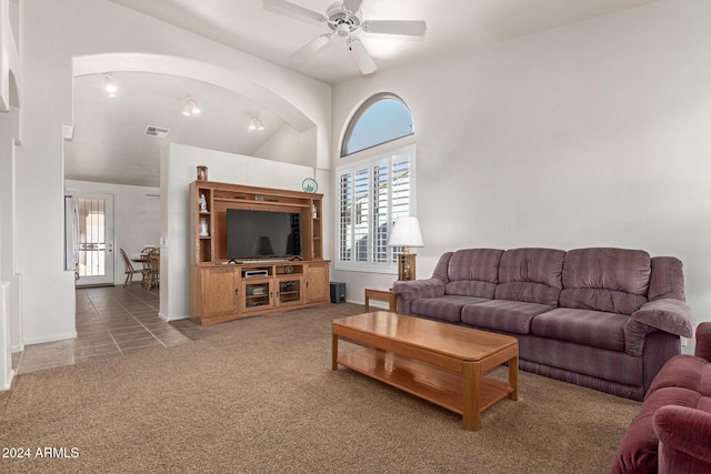 tiled living room with ceiling fan