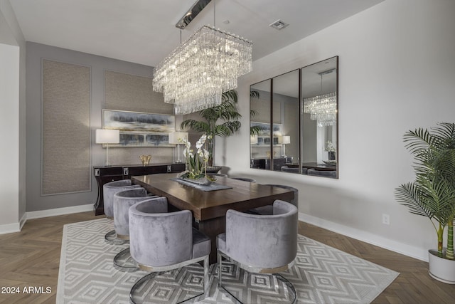 dining room with an inviting chandelier and dark parquet floors