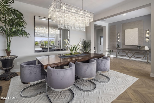 dining area with light parquet flooring and a chandelier