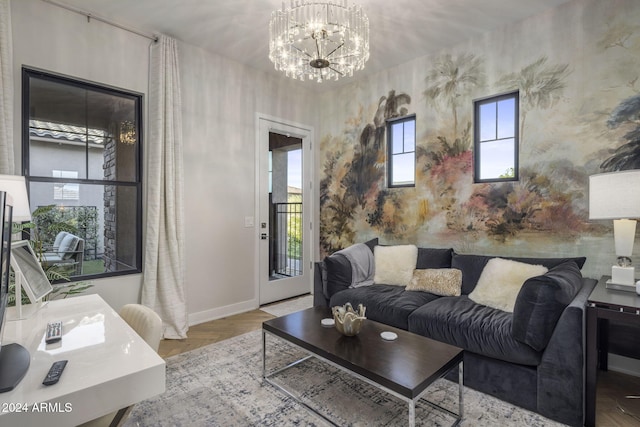 living room featuring hardwood / wood-style flooring and a chandelier